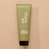 A green squeeze bottle of body wash that says “Be well”. “cypress and eucalyptus” and by “Plant apothecary”