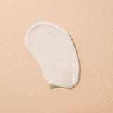 white dollop of face lotion face cream under eye cream from plant apothecary